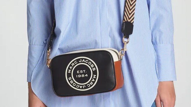 A Woman Wearing Marc Jacobs Flash Leather Camera Crossbody Bag