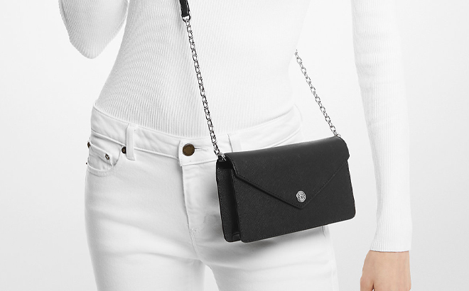 A Woman Wearing Michael Kors Small Saffiano Leather Envelope Crossbody