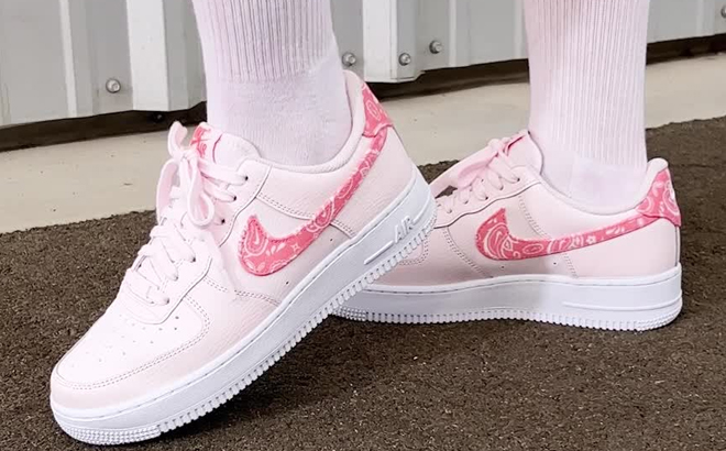 A Woman Wearing Nike Air Force 1 '07 Sneakers
