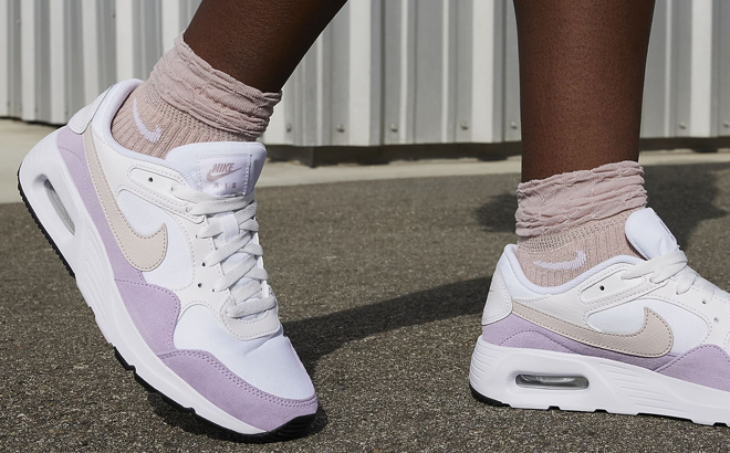 A Woman Wearing Nike Air Max SC Shoes
