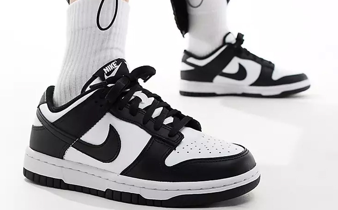 A Woman Wearing Nike Dunk Low Panda Shoes