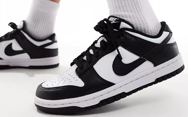 A Woman Wearing Nike Dunk Low Panda Sneakers