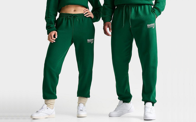 A Woman and Man Wearing Reebok Stack Logo Jogger Pants