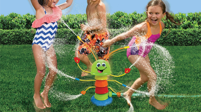 Banzai Caterpillar Lawn Sprinkler with Kids playing around it