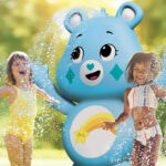 Care Bears Inflatable Sprinkler with Kids playing around it