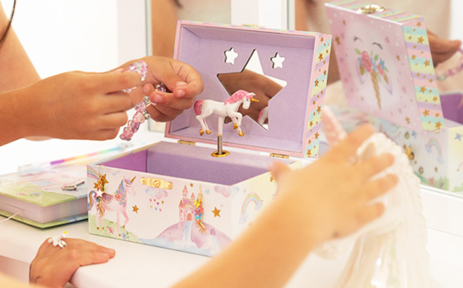 Girls Playing with a Unicorn Musical Jewelry Box
