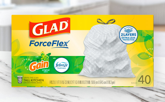 Glad Force Flex Tall Kitchen Drawstring 40 count Trash Bags on the Table