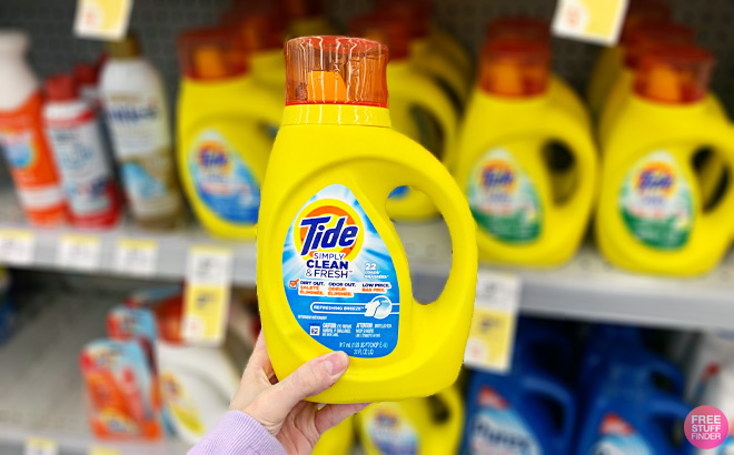 Hand Holding a Tide Simply Laundry Detergent