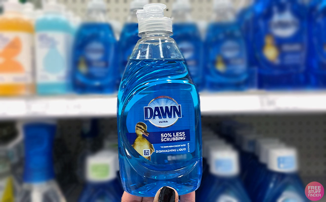 Hand holding Dawn Ultra Dishwashing Liquid Dish Soap