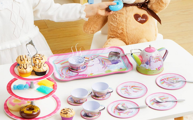 Little Girl Playing with a Unicorn Tea Party Set