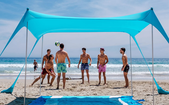 People having fun under 8 Person Beach Tent on the beach