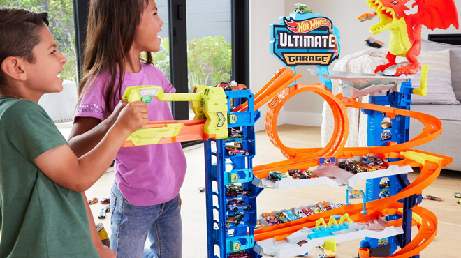 People playing with Hot Wheels City Ultimate Garage Playset