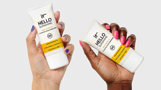 Persons Holding IT Cosmetics SPF 50 Sunscreen