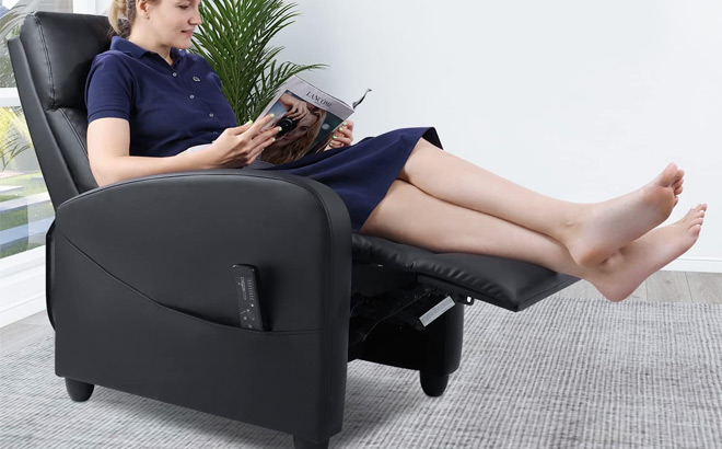 Woman Sitting in a Massage Reclining Chair