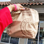 a Person Holding Chipotle Bag