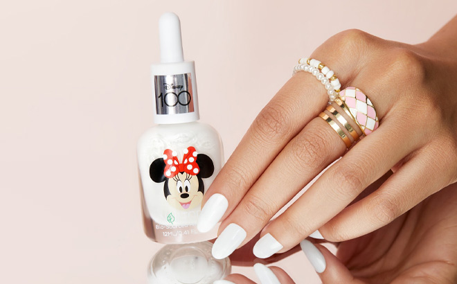 a Person Holding a Minnie Mouse Nail Polish
