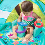 A Baby Playing on a SwimSchool Splash Play Mat