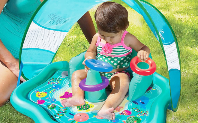 A Baby Playing on a SwimSchool Splash Play Mat