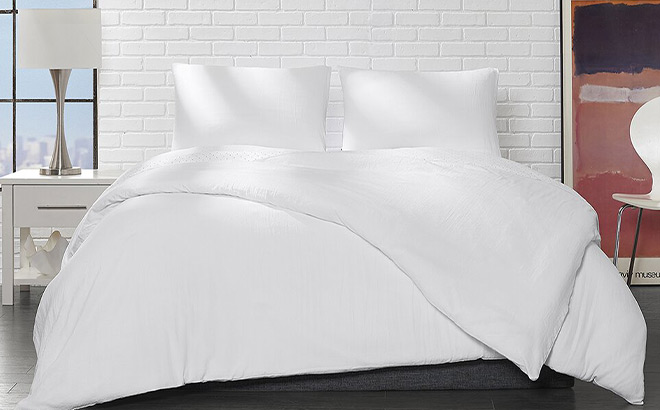 A Bed with White Comforter Set