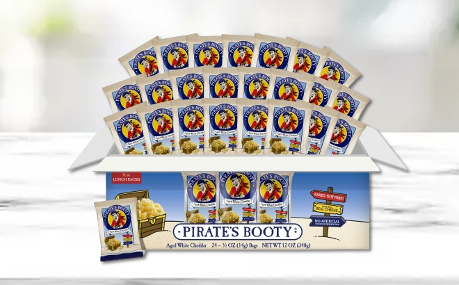 A Box of Pirates Booty Cheddar Cheese Puffs on a Table