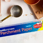 A Box of Reynolds Kitchens Parchment Paper on a Table