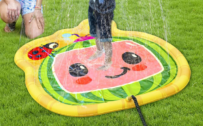 A Boy Playing on CoComelon Colorful Water Sprinkler Splash Pad