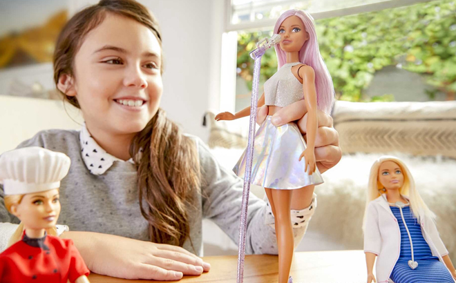 A Child Playing with Barbie Pop Star Fashion Doll