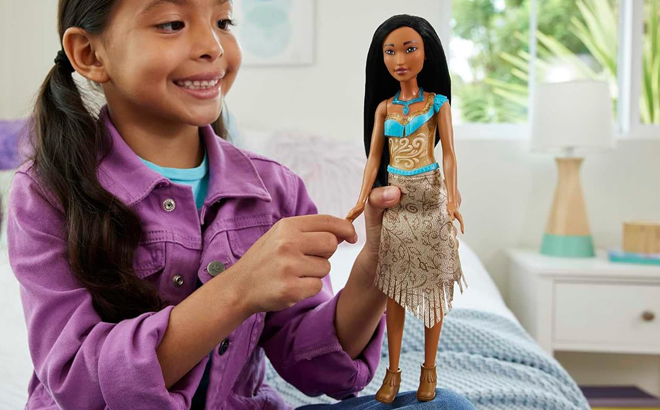 A Child Playing with Disney Pocahontas Fashion Doll