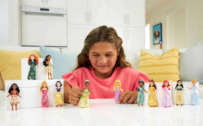 A Child Playing with Mattel Disney Princess Toys