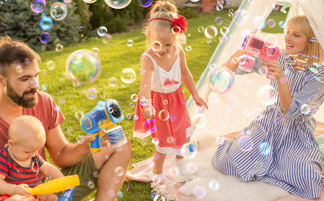 A Family Playing with EagleStone Bubble Gun Machines