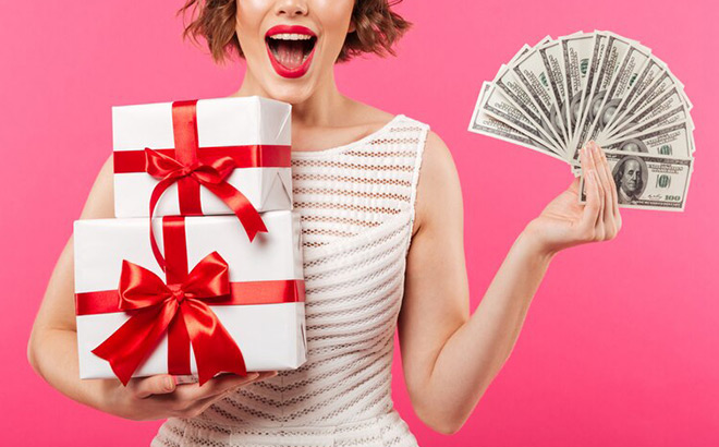 A Girl Holding Cash and Gifts