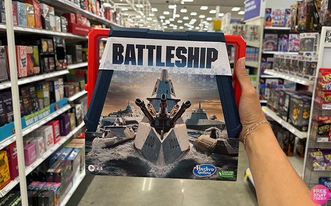 A Hand Holding Battleship Board Game 