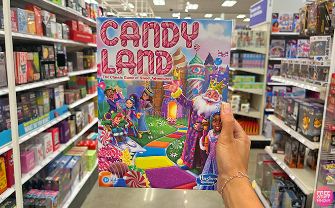 A Hand Holding Candy Land Board Game