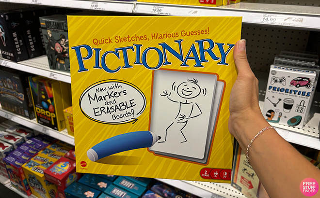 A Hand Holding Pictionary Board Game 