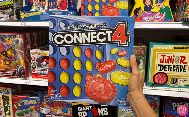 A Hand Holding Connect 4 Board Game