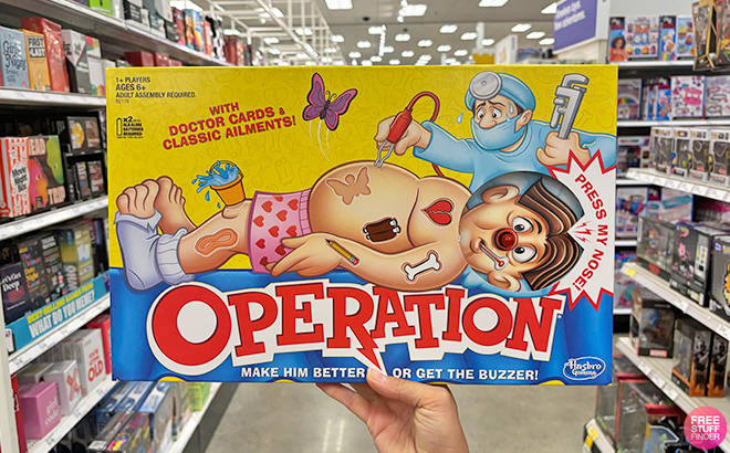 A Hand Holding Operation Board Game