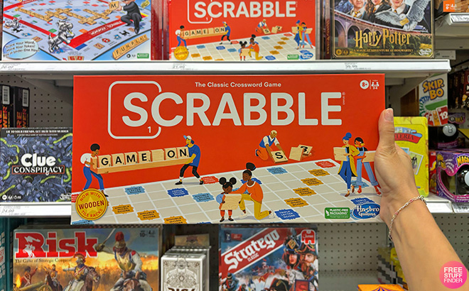 A Hand Holding Scrabble