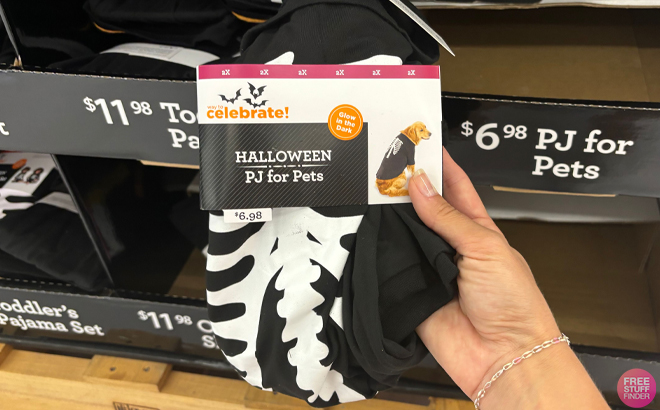 A Hand holding Halloween Pet Glow In The Dark Skeleton Pajamas