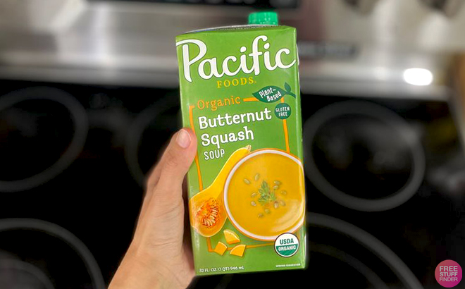 A Hand holding a Carton of Pacific Foods Organic Butternut Squash Soup