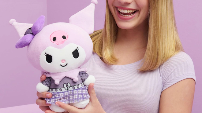 A Lady Holding a Hello Kitty Kuromi 8 inch Plush