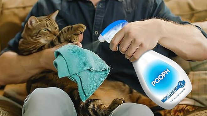 A Man Holding a Cat and Pooph Pet Odor Eliminator Spray