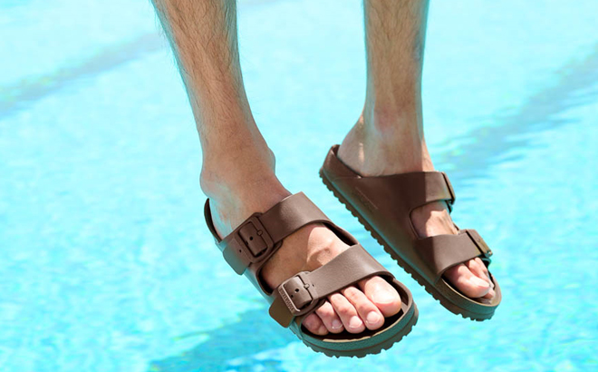 A Man Wearing Birkenstock Arizona EVA Sandals in Roast Color