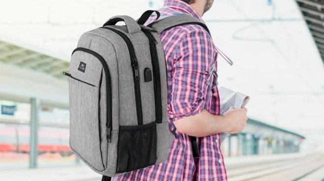 A Man Wearing Matein Travel Laptop Backpack