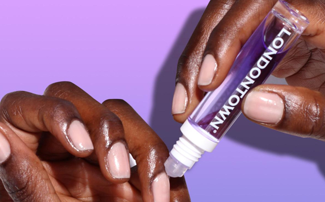 A Person Applying Londontown Violet Vibes to her Nails