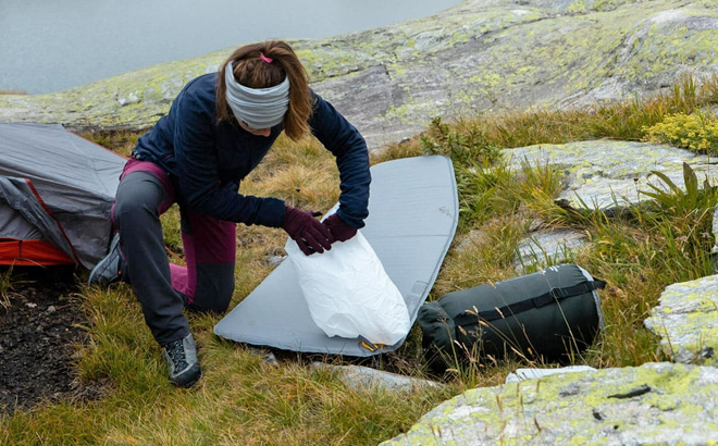 A Person Camping Using a Decathlon Sleeping Pad