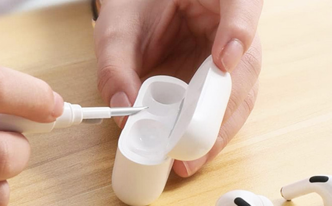 A Person Cleaning Airpods Case