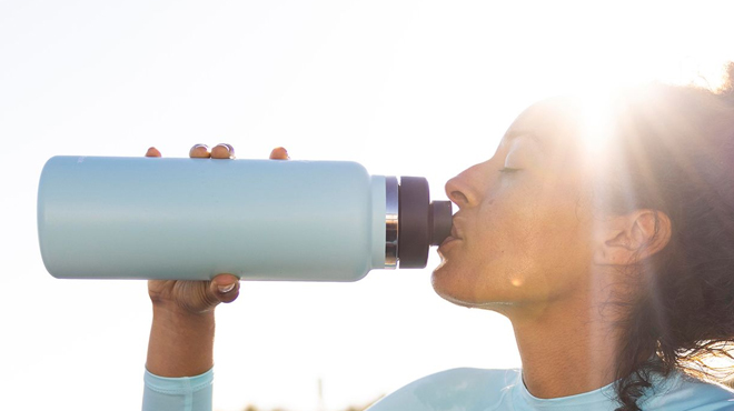 A Person Drinking from Hydro Flask 40 oz Wide Mouth Tumbler