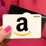 A Person Holding Amazon Gift Cards