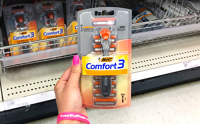 A Person Holding BIC Comfort 3 Mens Disposable Razor Kit