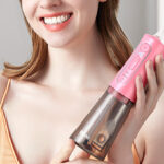 A Person Holding Bitvae Water Flosser in Quartz Pink Color